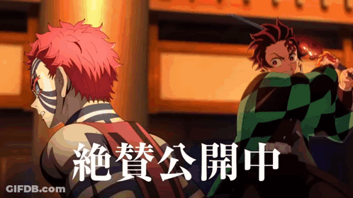 A Couple Of Anime Characters Standing Next To Each Other With Chinese Writing Behind Them GIF