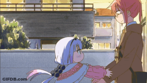 A Couple Of Anime Characters Standing Next To Each Other With One Of Them Wearing A Sweater With The Letter O On It GIF