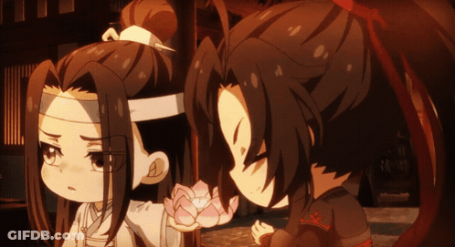 A Couple Of Anime Characters With One Holding A Flower GIF