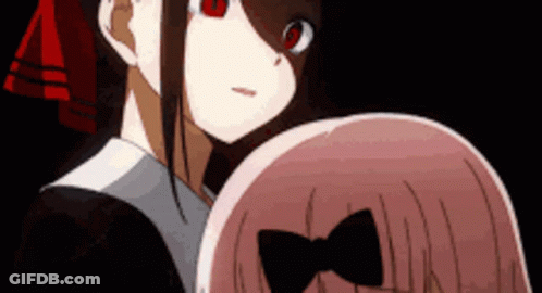 A Couple Of Anime Girls Are Standing Next To Each Other And Looking At Each Other . GIF
