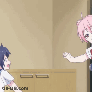 A Couple Of Anime Girls Hugging Each Other In A Room GIF