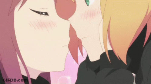 A Couple Of Anime Girls Kissing Each Other With A Pink Background GIF