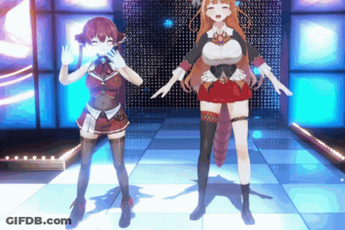 A Couple Of Anime Girls Standing On A Stage GIF