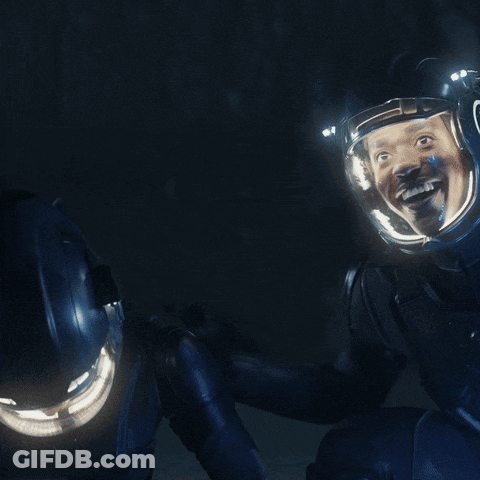 A Couple Of Astronauts Are Looking At Each Other With The Words Look In Yellow GIF