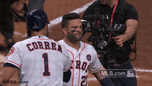 A Couple Of Baseball Players One Of Whom Has Correa On The Back Of His Jersey GIF