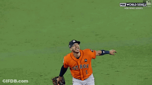 A Couple Of Baseball Players One Of Whom Has The Number 27 On His Jersey GIF