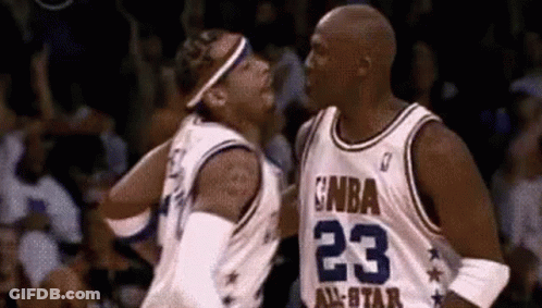 A Couple Of Basketball Players Are Standing Next To Each Other On A Court . GIF