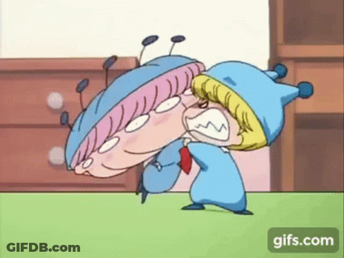 A Couple Of Cartoon Characters Are Fighting Each Other On A Carpet . GIF