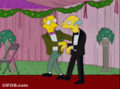 A Couple Of Cartoon Characters Are Standing Next To Each Other On A Red Carpet GIF