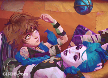 A Couple Of Cartoon Characters Laying On A Bed With A Ball In The Background GIF