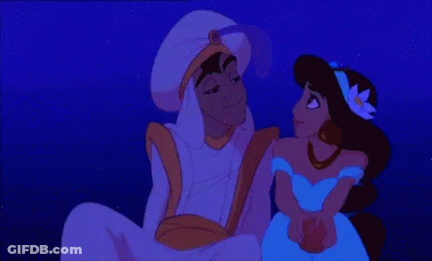 A Couple Of Cartoon Characters Sitting Next To Each Other In The Dark GIF