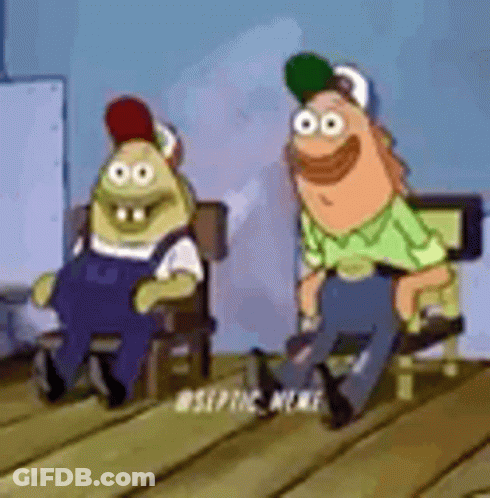 A Couple Of Cartoon Characters Sitting Next To Each Other On A Wooden Floor . GIF
