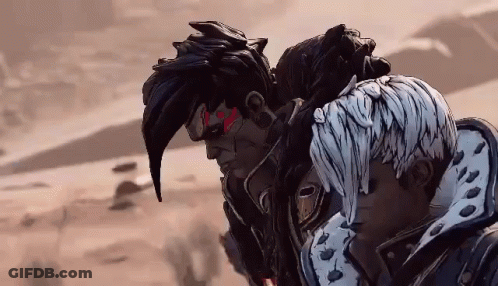 A Couple Of Cartoon Characters Standing Next To Each Other In A Desert GIF