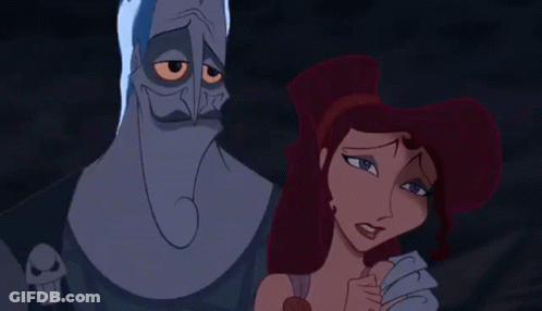 A Couple Of Cartoon Characters Standing Next To Each Other . GIF
