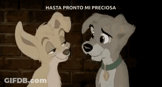 A Couple Of Cartoon Dogs Standing Next To Each Other . GIF
