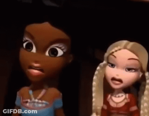 A Couple Of Cartoon Dolls Standing Next To Each Other . GIF
