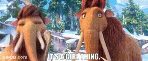 A Couple Of Cartoon Elephants Are Standing Next To Each Other In The Snow . GIF