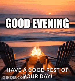 A Couple Of Chairs Sitting Next To A Fire On A Beach At Sunset . GIF