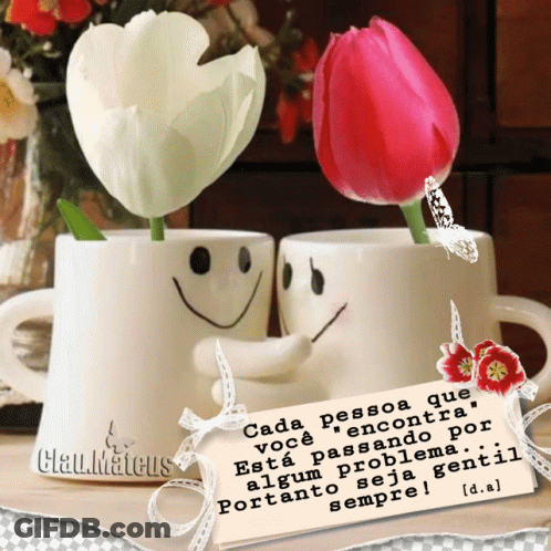 A Couple Of Cups With Smiley Faces On Them And Flowers In Them GIF