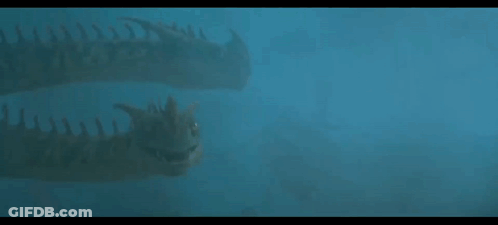 A Couple Of Dinosaurs Swimming In The Water . GIF