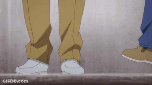 A Couple Of Feet Standing Next To Each Other On A Ledge GIF