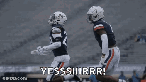 A Couple Of Football Players Are Running On A Field And One Of Them Is Saying Yes . GIF