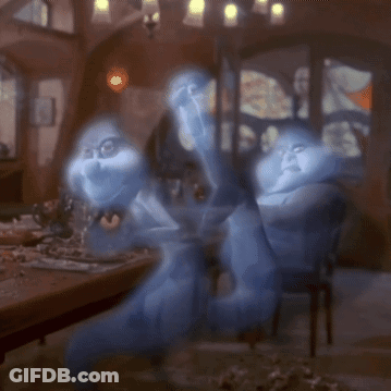A Couple Of Ghosts Are Sitting At A Table In A Dark Room GIF