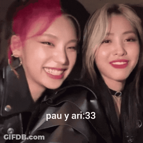 A Couple Of Girls Are Smiling With The Words Pau Y Ari : 33 On The Bottom Right GIF