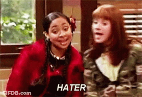 A Couple Of Girls Are Standing Next To Each Other And One Of Them Is Saying Hater . GIF