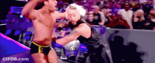 A Couple Of Men Are Fighting In A Wrestling Ring . GIF