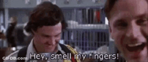 A Couple Of Men Are Standing Next To Each Other And One Of Them Is Saying `` Hey , Smell My Fingers '' . GIF