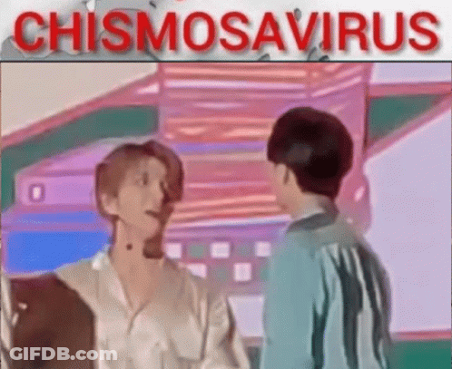 A Couple Of Men Are Standing Next To Each Other In A Room And Talking To Each Other . GIF