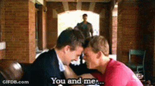 A Couple Of Men Kissing With The Words You And Me Behind Them GIF