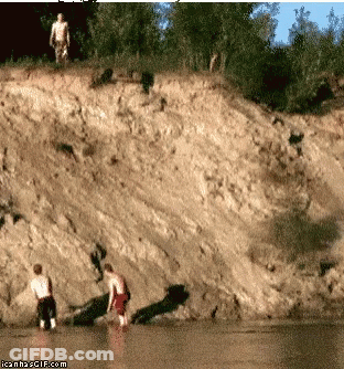 A Couple Of Men Standing On A Cliff Overlooking A Body Of Water With Icanh2gif.com Written Below Them GIF