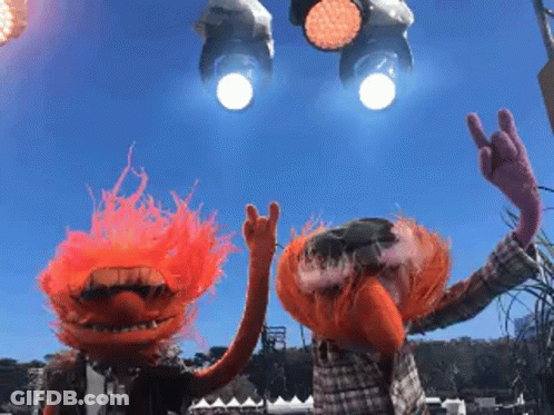 A Couple Of Muppets Giving The Horns Sign With Their Hands GIF