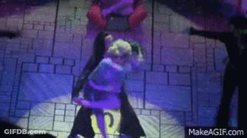 A Couple Of People Are Dancing On A Stage With A Makeagif.com Logo In The Corner . GIF