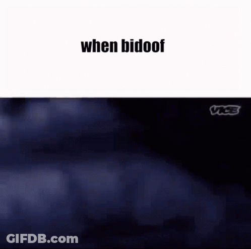 A Couple Of People Are Standing Next To Each Other In A Park . GIF