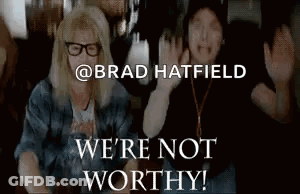 A Couple Of People Sitting Next To Each Other With The Words We 'Re Not Worthy Written On The Bottom . GIF