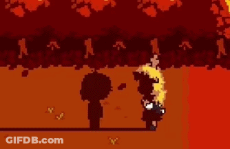 A Couple Of People Standing Next To Each Other In Front Of A Tree . GIF