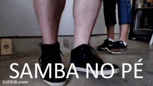 A Couple Of People Standing Next To Each Other With Samba No Pe Written On The Bottom GIF
