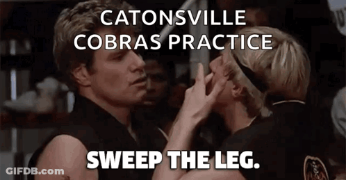 A Couple Of People Standing Next To Each Other With The Words Catonsville Cobras Practice Sweep The Leg Above Them GIF