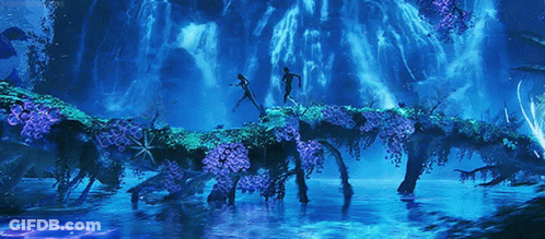 A Couple Of People Standing On A Bridge Over A River GIF