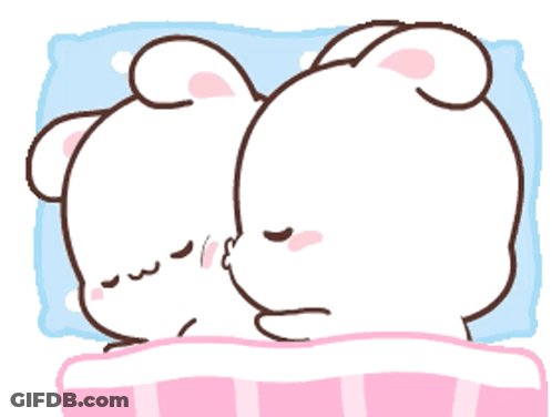A Couple Of Rabbits Are Laying On A Bed And One Is Kissing The Other GIF