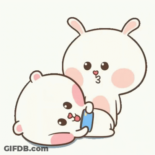 A Couple Of Rabbits Are Sitting Next To Each Other And Hugging Each Other . GIF