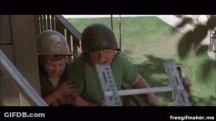 A Couple Of Soldiers Standing Next To Each Other On A Staircase . GIF