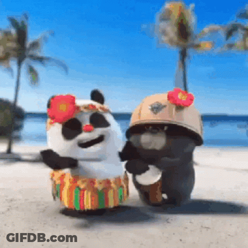 A Couple Of Stuffed Animals Are Dancing On A Beach . One Of The Animals Is Wearing A Hula Skirt . GIF