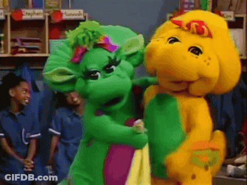 A Couple Of Stuffed Animals Are Standing Next To Each Other In A Room With A Sign That Says Stephen On It GIF