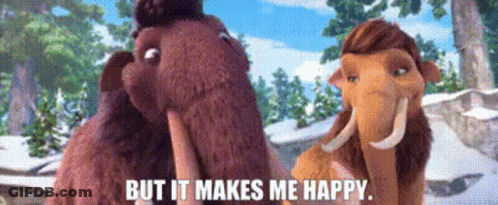 A Couple Of Stuffed Mammoths Standing Next To Each Other With The Words But It Makes Me Happy GIF