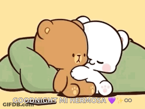 A Couple Of Teddy Bears Are Hugging Each Other On A Bed . GIF