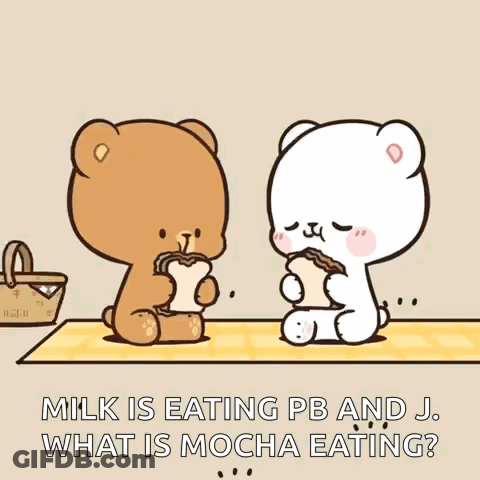 A Couple Of Teddy Bears Are Sitting At A Table Eating Bread . GIF